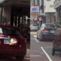 找停車位時發現女子用嬰兒車和人體佔位，車子靠近時女子用手勢表示不能停。社員表示:違規還有理趕人?