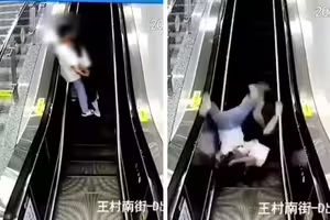 小情侶手扶梯激吻 下秒「倒頭栽」往後摔 小情侶手扶梯激吻 下秒「倒頭栽」往後摔