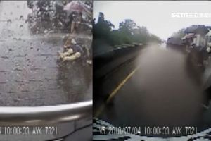 下雨天小貨車自撞護欄　駕駛彈飛車外