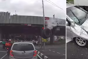 輪胎從天而降 砸中汽車!騎士倒地 輪胎從天而降 砸中汽車!騎士倒地
